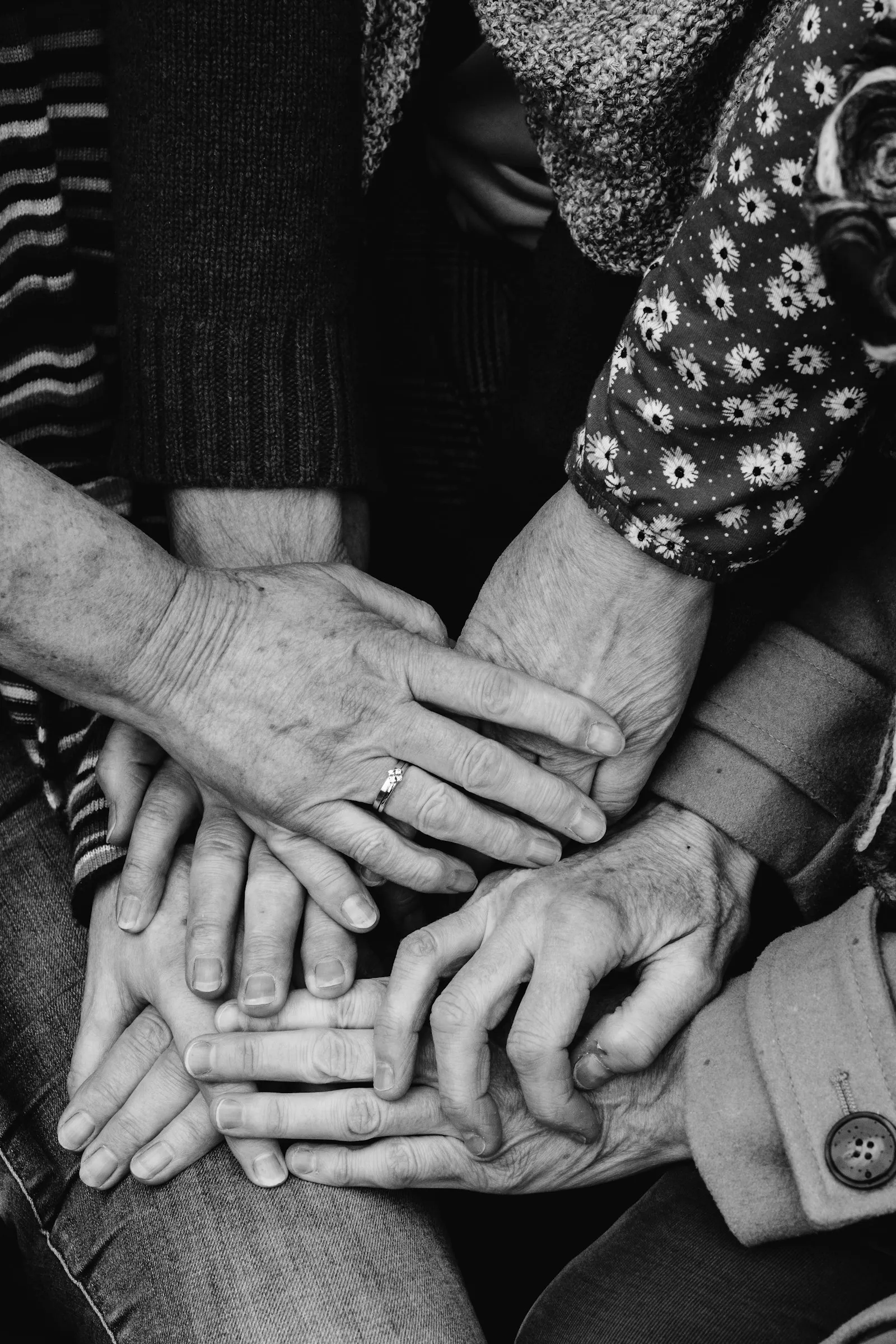 Hands together, symbolising community and collaboration